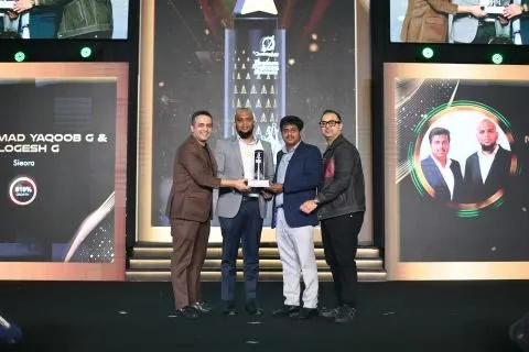Sieora founders receiving an industry award on stage